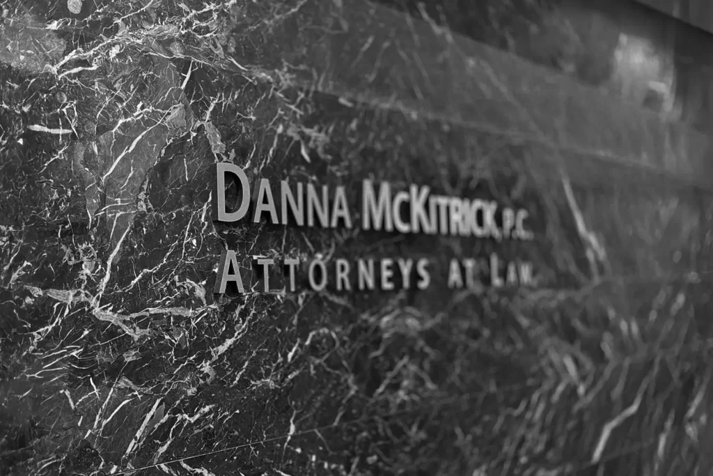 Danna McKitrick's logo wordmark on a marble wall