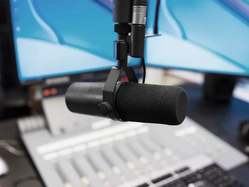 Close-up of a microphone in a radio station recording booth